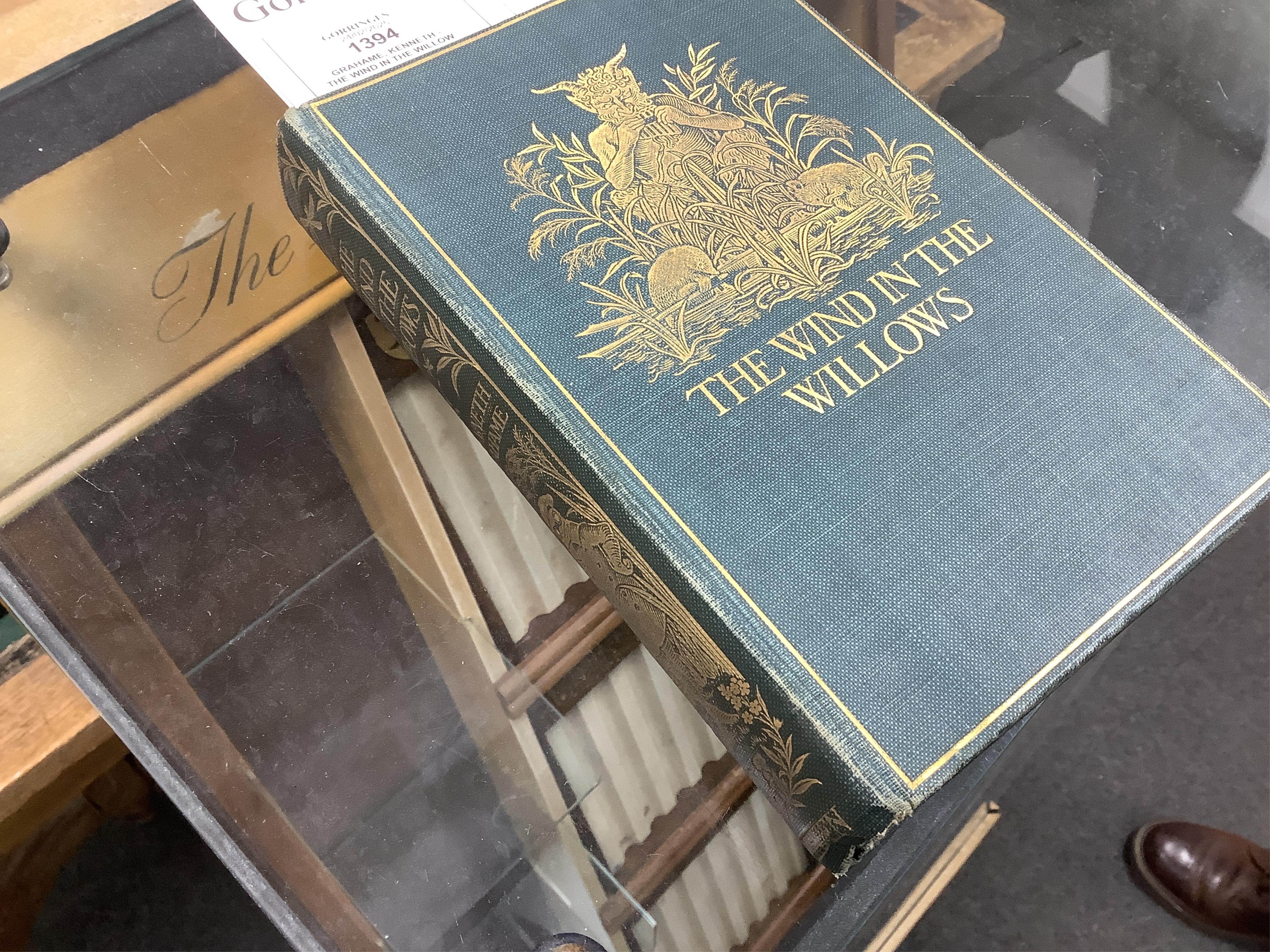 Grahame, Kenneth - The Wind in the Willows ... First Edition. frontispiece (by Graham Robertson) and tissue guard, half title; original gilt ruled and pictorial cloth, gilt top with other edges rough trimmed. Methuen and